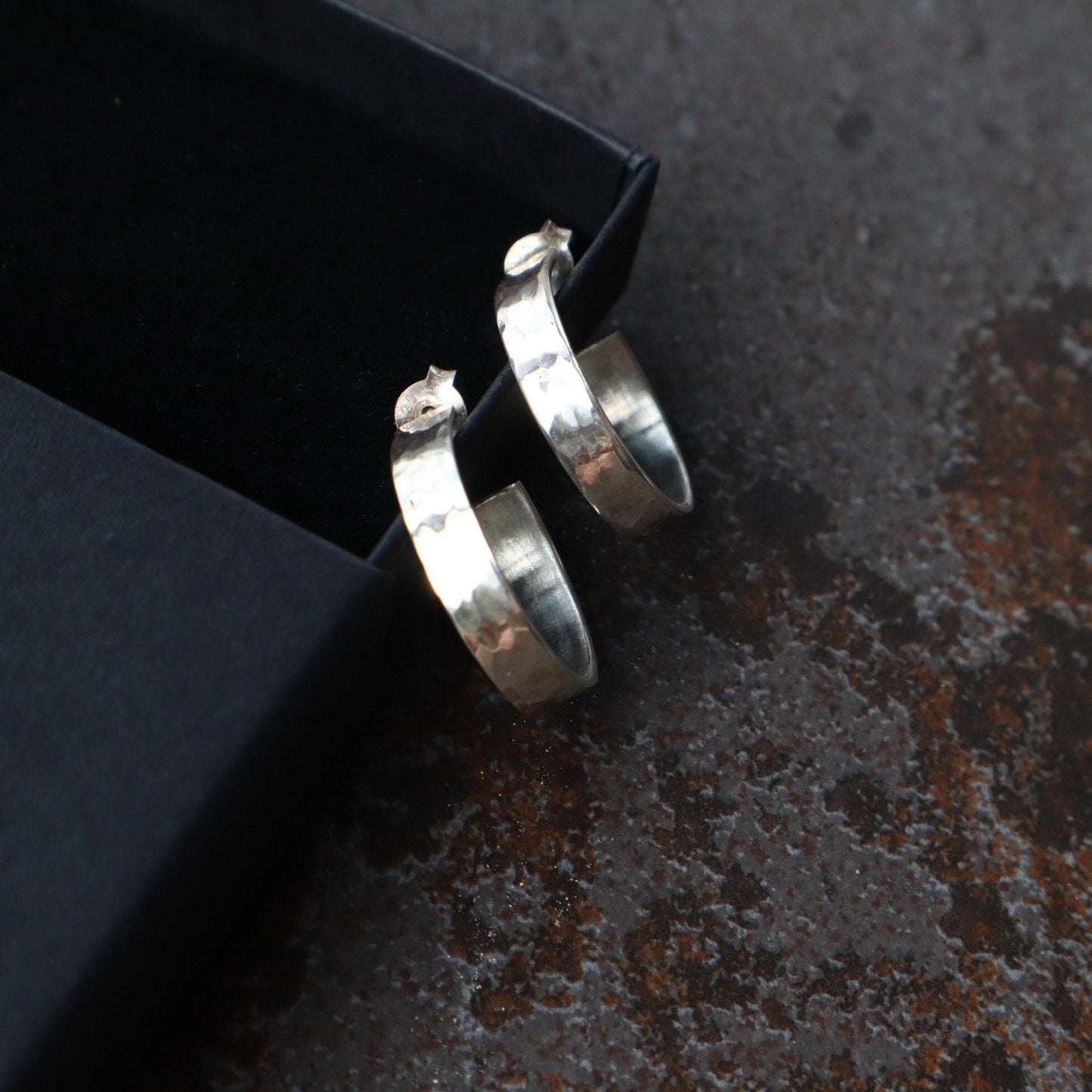 Textured Sterling Silver half hoops with scroll back for a comfortable size.